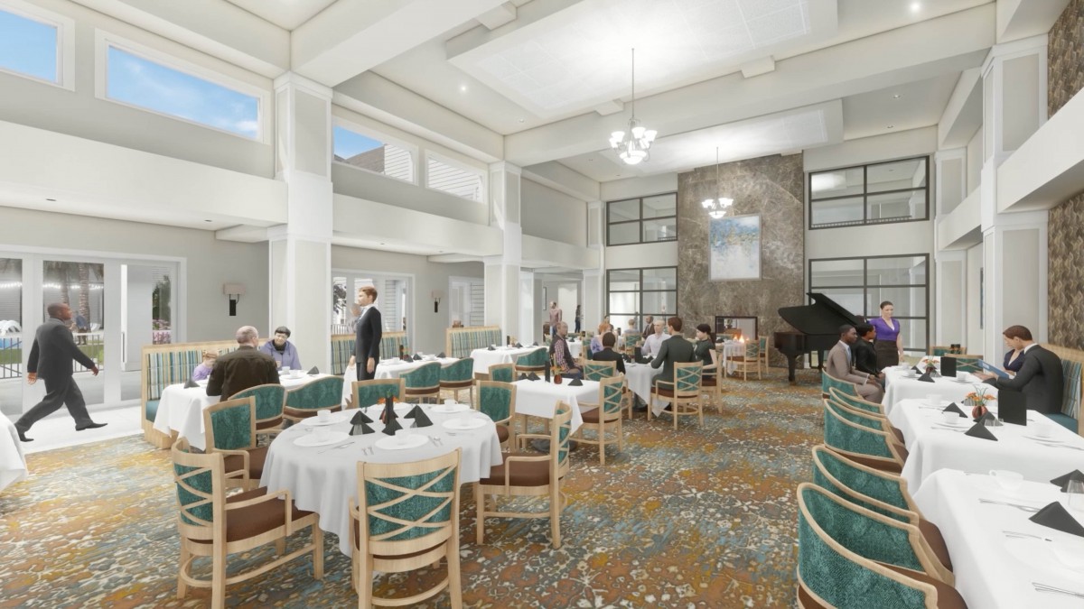 An elegant dining area with tables and chairs, featuring high ceilings and a central chandelier.