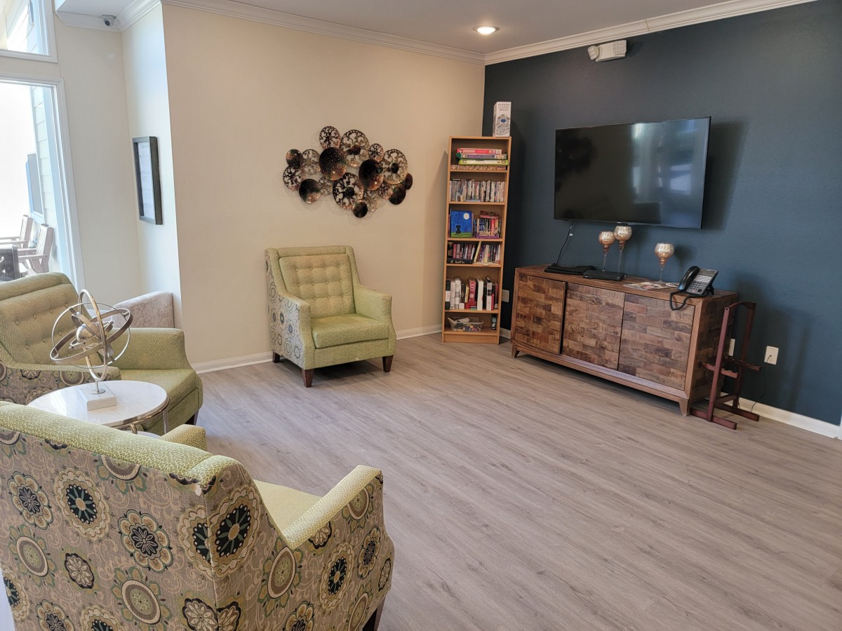 A cozy living room with comfortable seating and a TV.