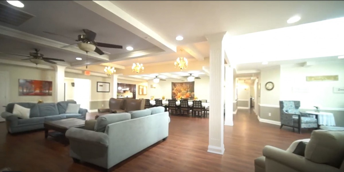 Spacious and elegantly designed living area with a comfortable seating arrangement and an adjoining dining space.