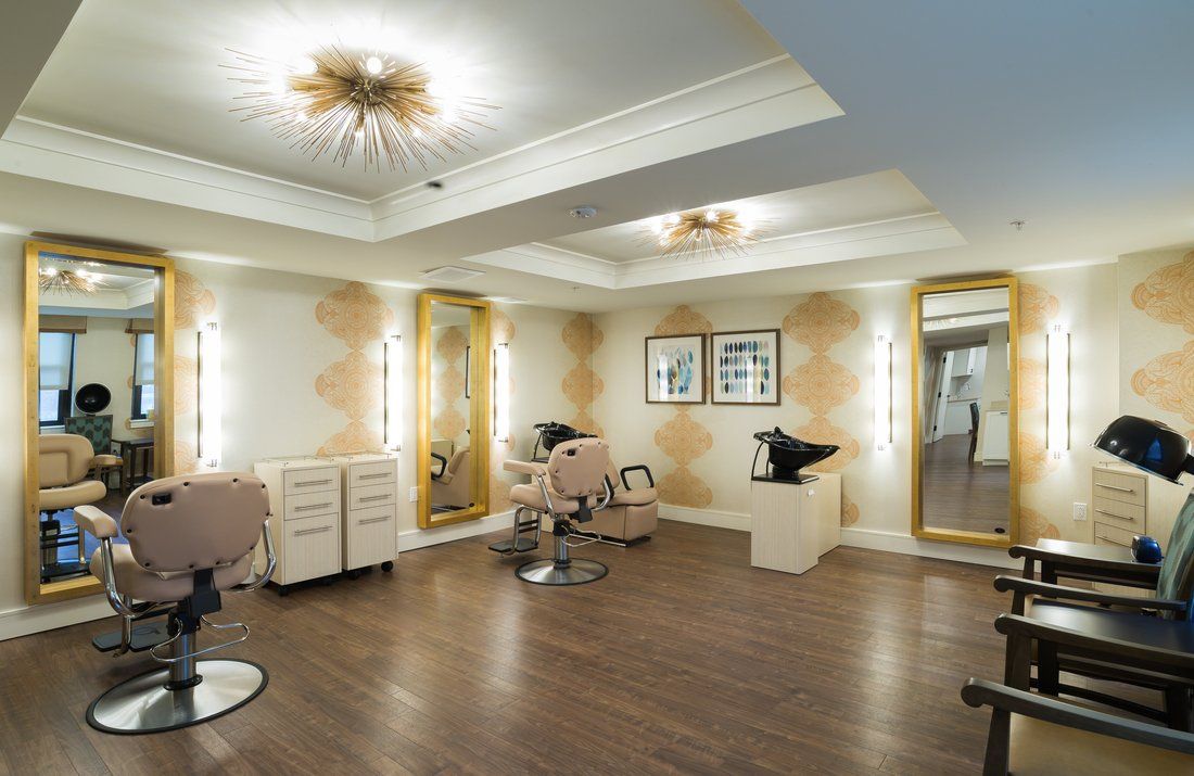 Elegant beauty salon interior with modern decor and ample lighting.