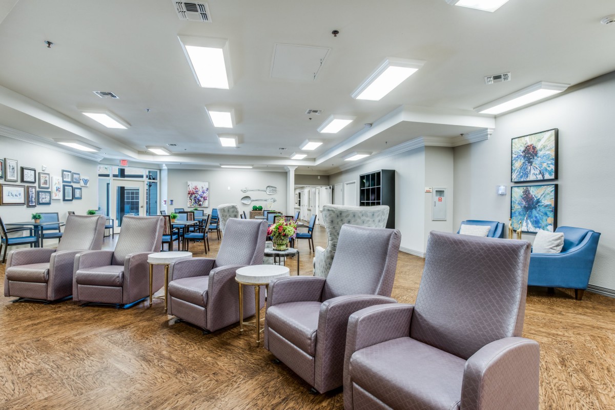 A modern and spacious waiting area with comfortable armchairs.