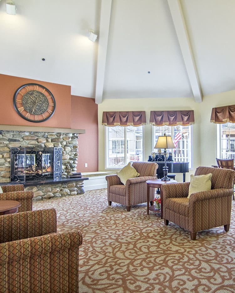 Cozy living room with a stone fireplace and comfortable seating.