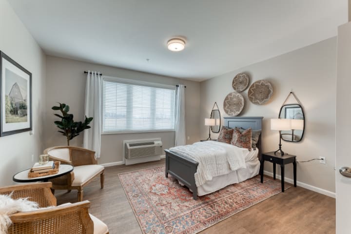 A stylish and cozy bedroom with modern decor and natural lighting.