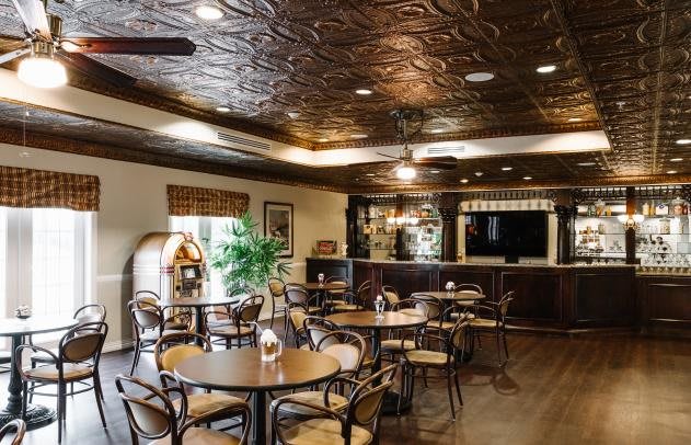 Cozy cafe interior with stylish decor and comfortable seating.