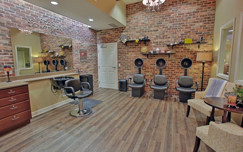 A stylish hair salon with modern decor and comfortable seating.