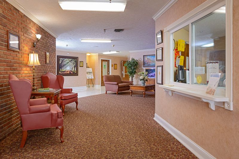 A cozy waiting area with comfortable seating and warm lighting.