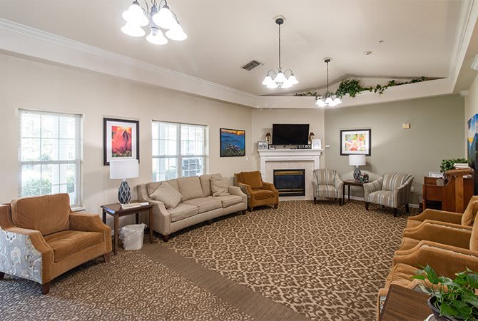 Cozy living room with comfortable seating, a fireplace, and modern decor.