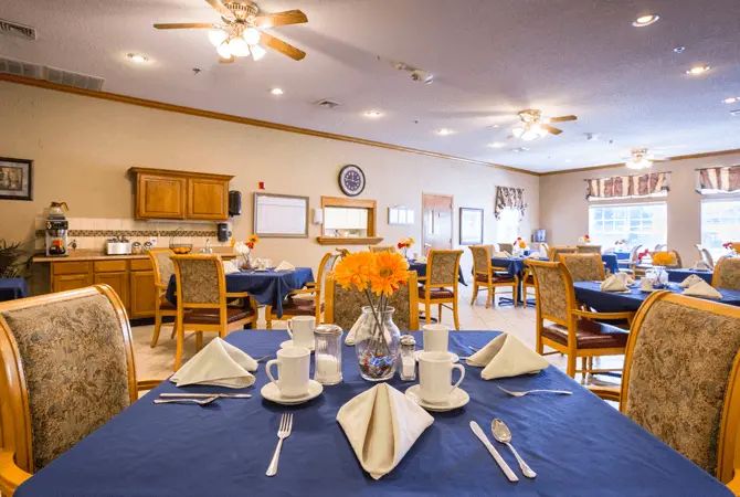 A well-set dining table in a cozy restaurant interior.