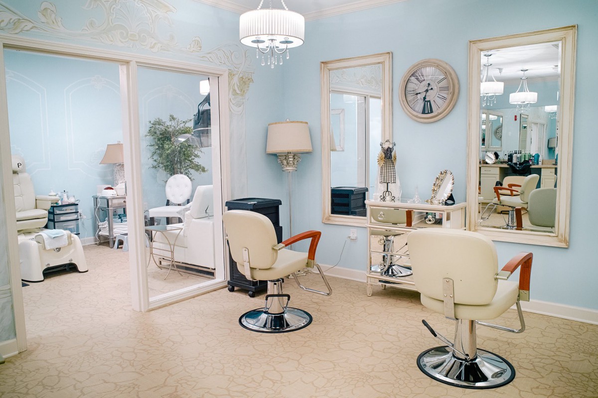 A vintage-style salon with retro furnishings and light blue walls.