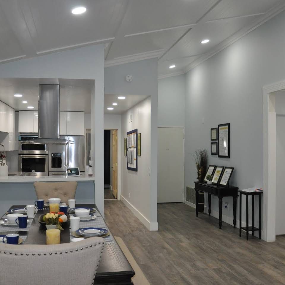 A modern open concept kitchen and dining area with elegant home decor.