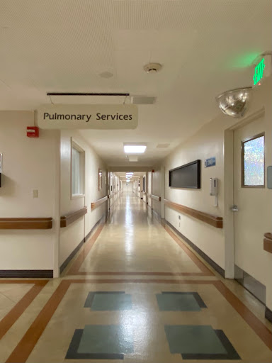 A hallway in a hospital leading to pulmonary services.