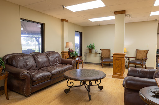 A cozy living room setting featuring comfortable leather sofas and a stylish coffee table.