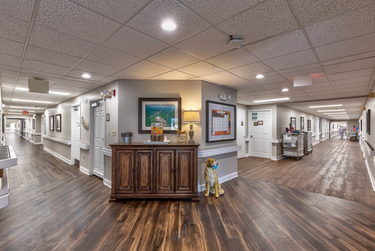 A welcoming reception area with artwork and a hardwood floor.