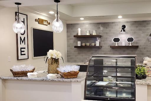 A modern caf interior showcasing a beautifully arranged counter and elegant decor.