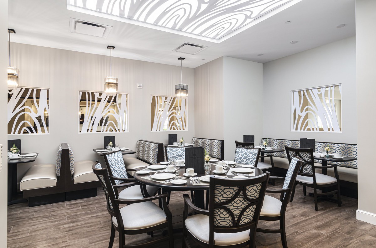 A modern and elegant restaurant dining room with stylish seating arrangements.