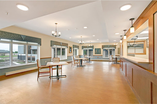 A spacious and well-lit community dining area, ready for gatherings.