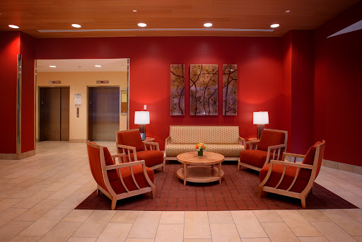 A cozy and modern lobby featuring comfortable seating and a warm color palette.