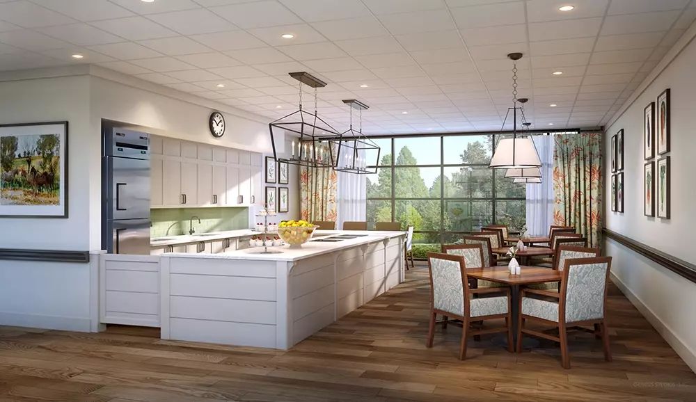 A spacious modern kitchen and dining area with an island countertop and abundant natural light.