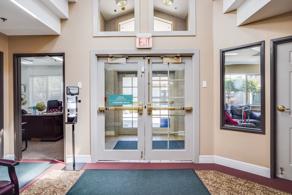 A welcoming entrance with glass double doors leading to an interior space.