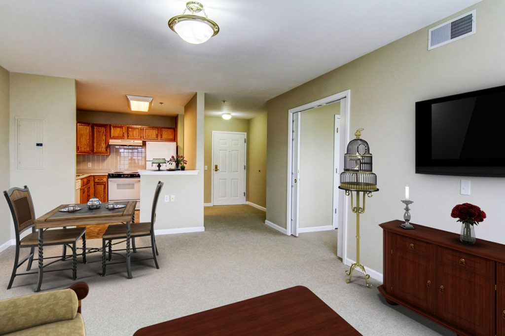 A cozy living space with an open kitchen and dining area.