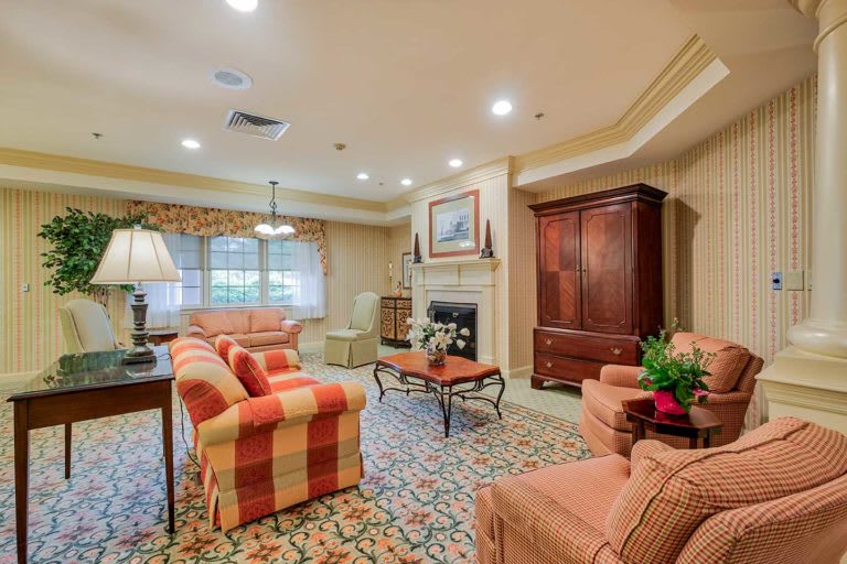 A cozy living room with comfortable seating and a warm decorative ambiance.