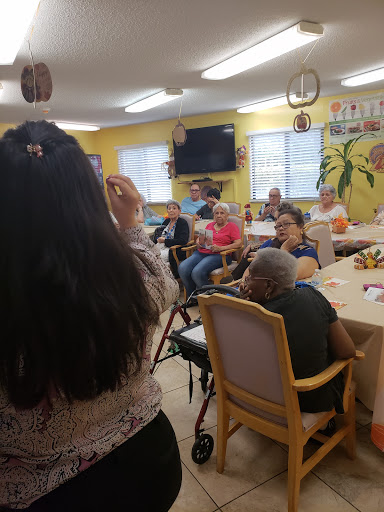 A vibrant community gathering at a senior center, where participants engage in an interactive session.