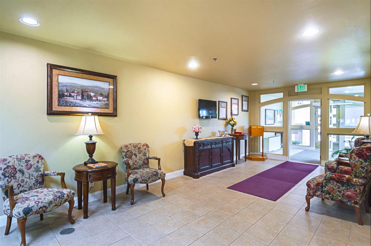 A well-lit lobby with comfortable seating and decorative elements.