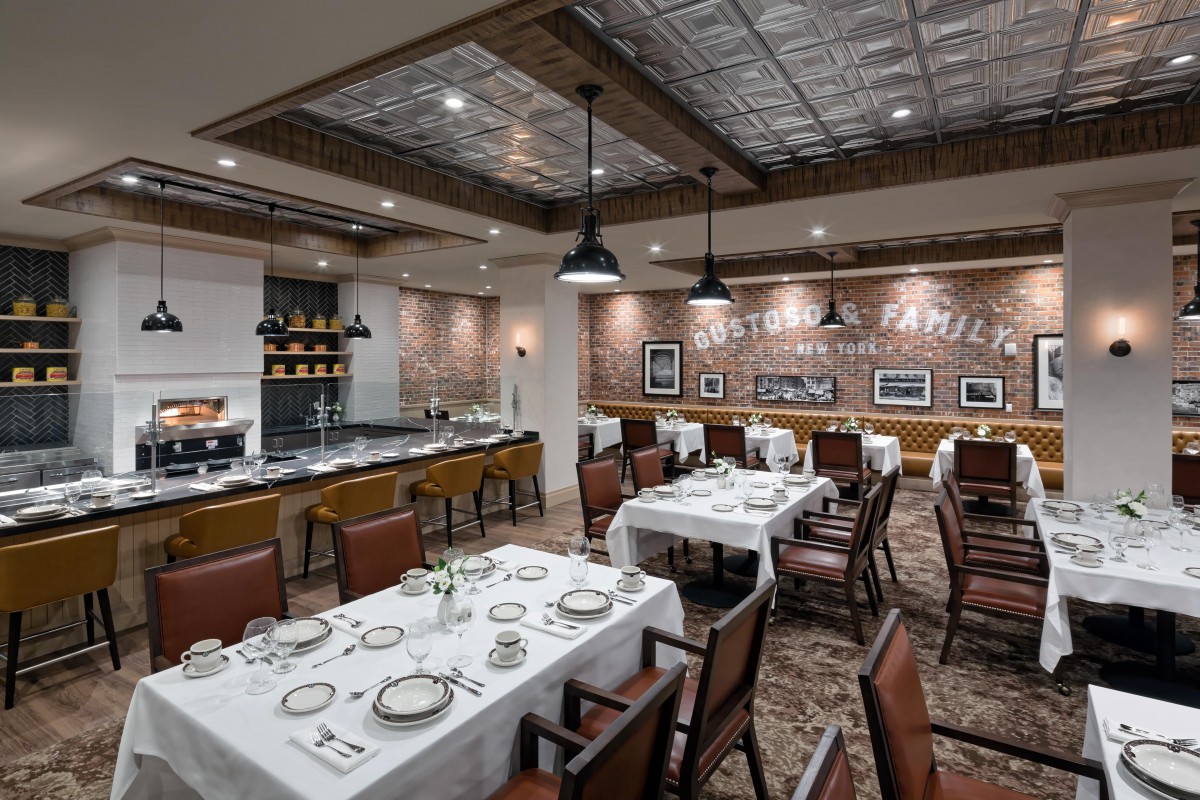 An elegant restaurant dining area with neatly set tables and decorative interiors.