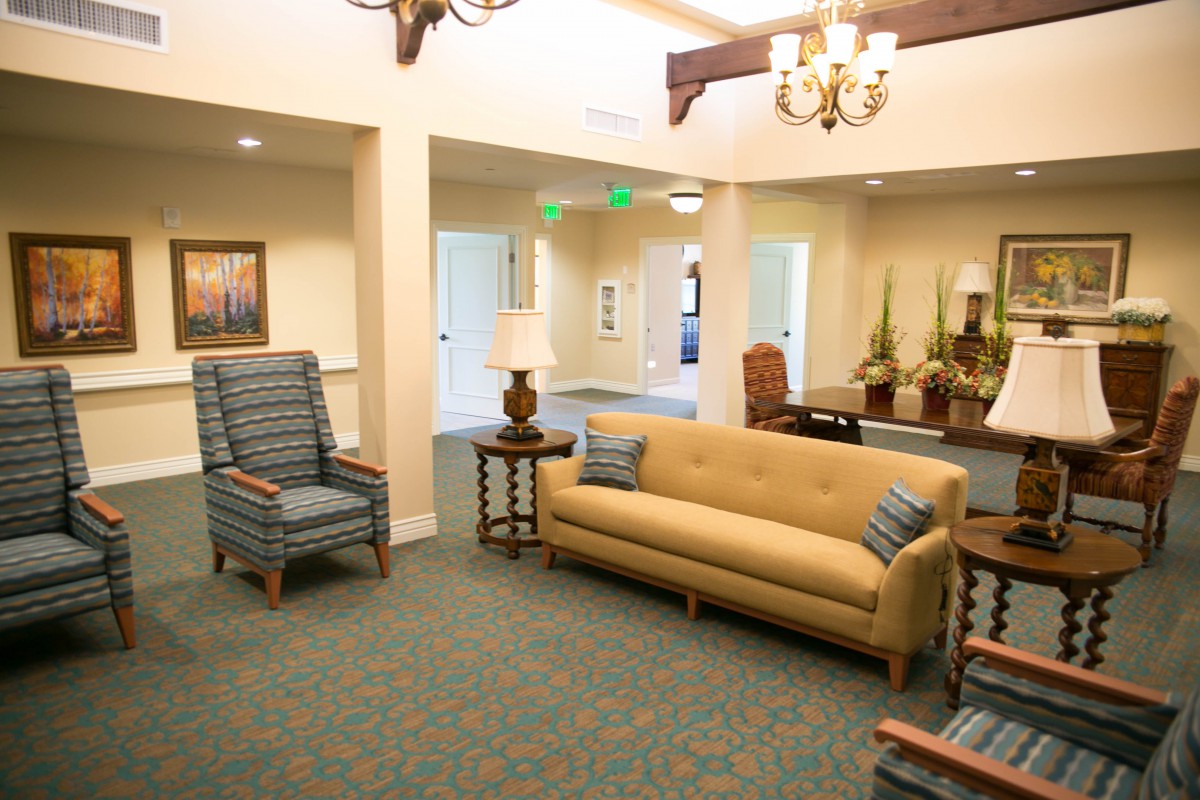 A cozy living room with comfortable seating and warm lighting.