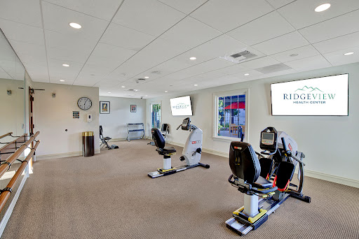 A well-equipped fitness studio featuring recumbent bikes and ample workout space.