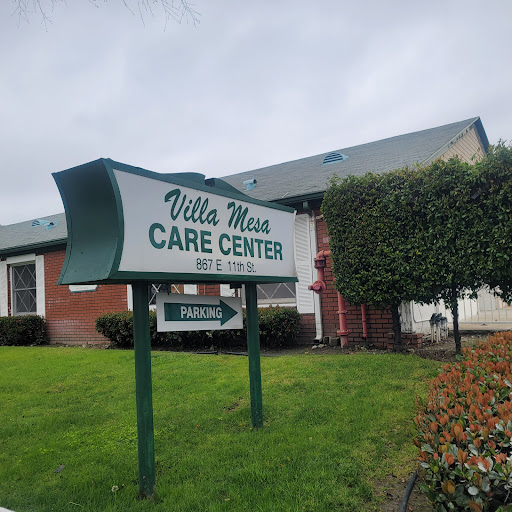 A view of the Villa Maria Care Center, showcasing its welcoming sign and well-kept surroundings.