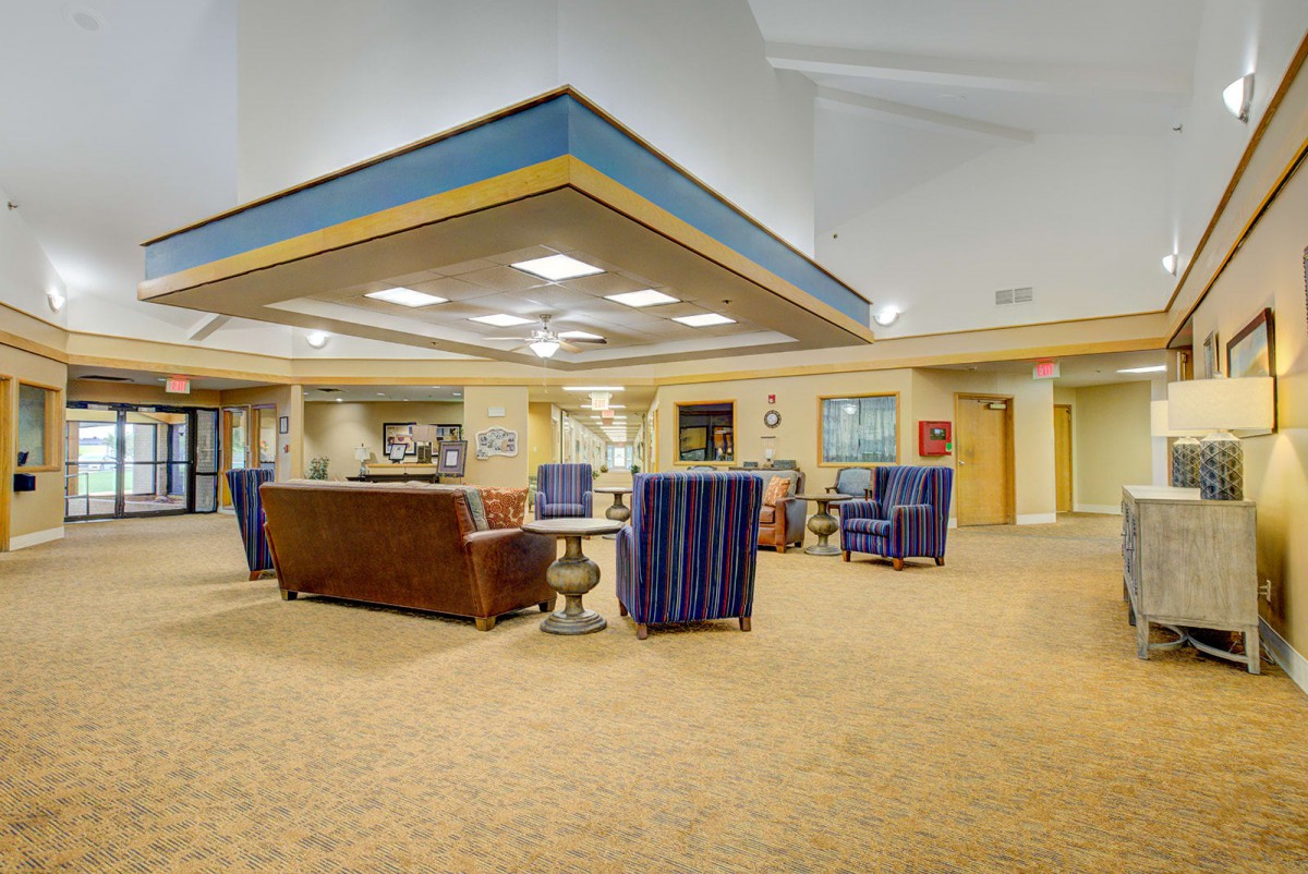 A spacious lobby area with comfortable seating and warm lighting.
