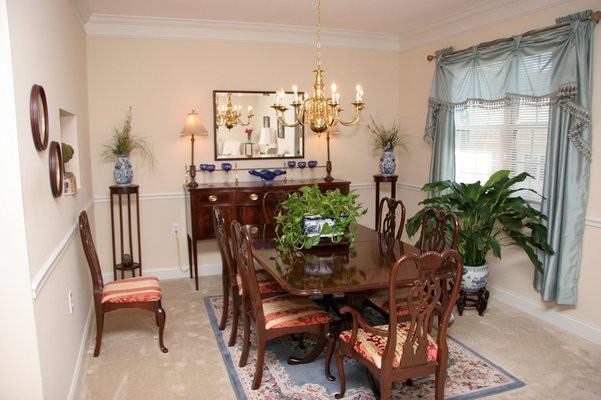 A classic dining room with elegant furniture and decor.