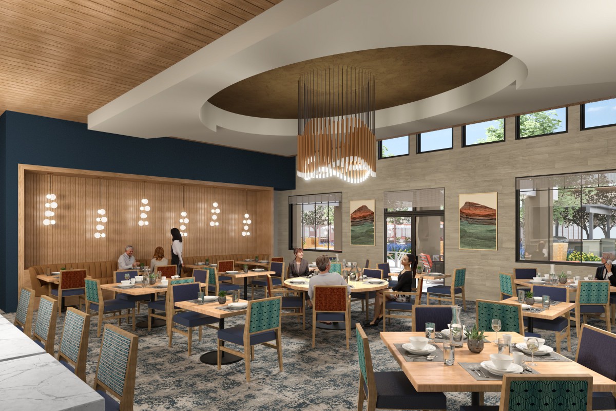 A modern restaurant interior with stylish lighting and seating arrangements.