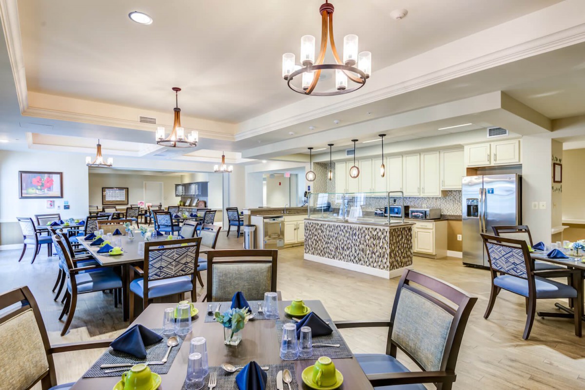 Elegant dining room with neatly set tables and modern decor.