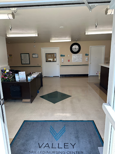 A welcoming interior view of a healthcare office's waiting area and reception.