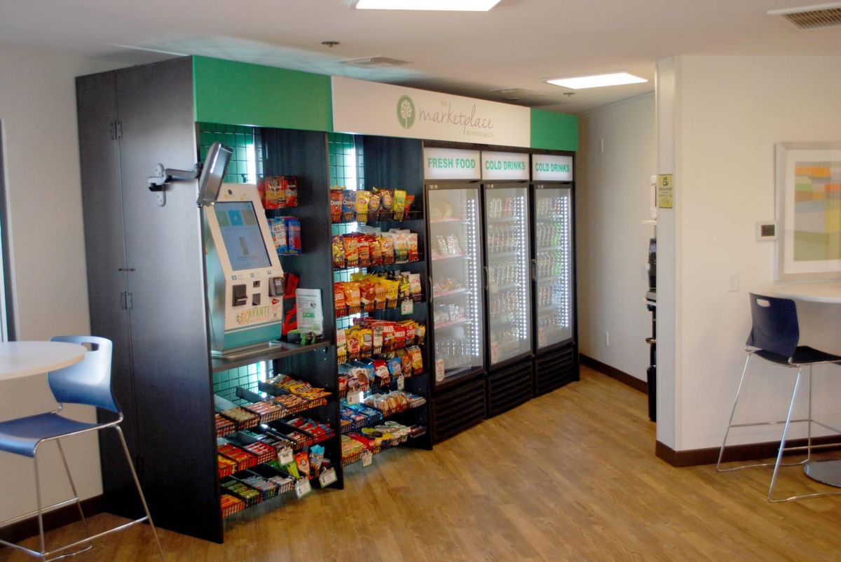 A modern vending area with snacks and beverages available.