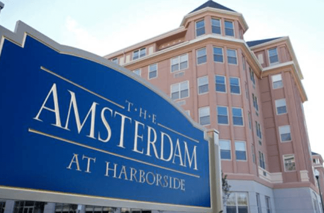 The Amsterdam at Harborside building with prominent signage.