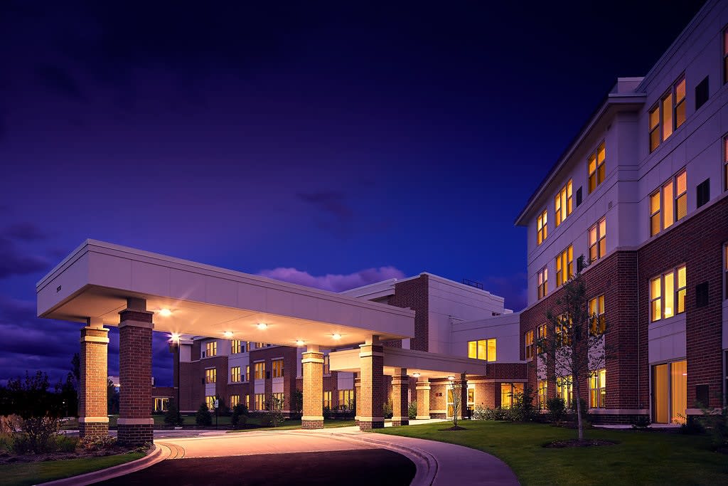 A well-lit building entrance at night.