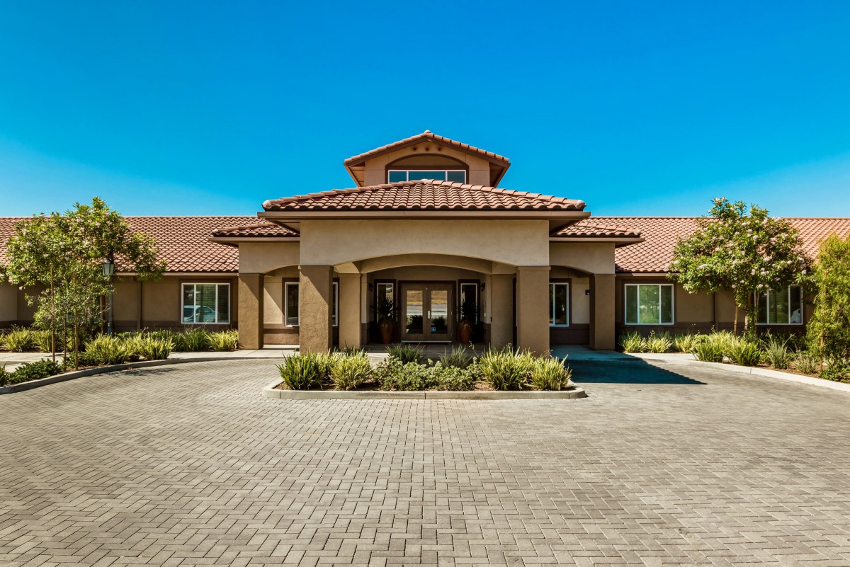 A beautiful residential building with a welcoming entrance and well-maintained landscaping.