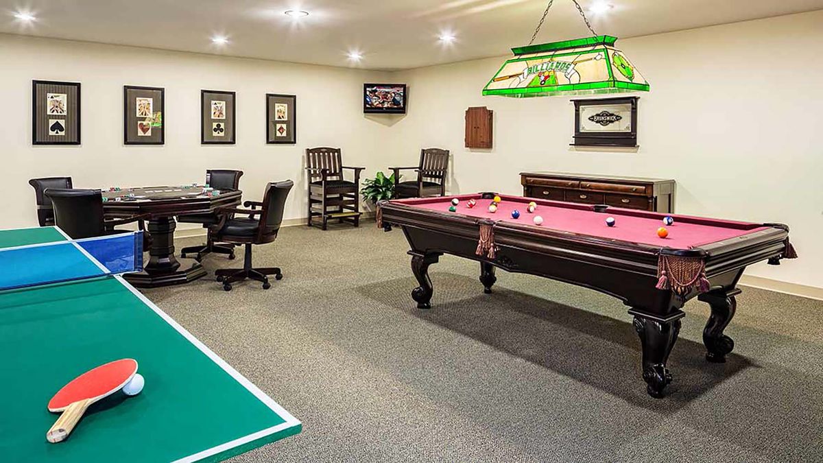 A cozy game room featuring a billiards table and a poker table, perfect for indoor recreation.