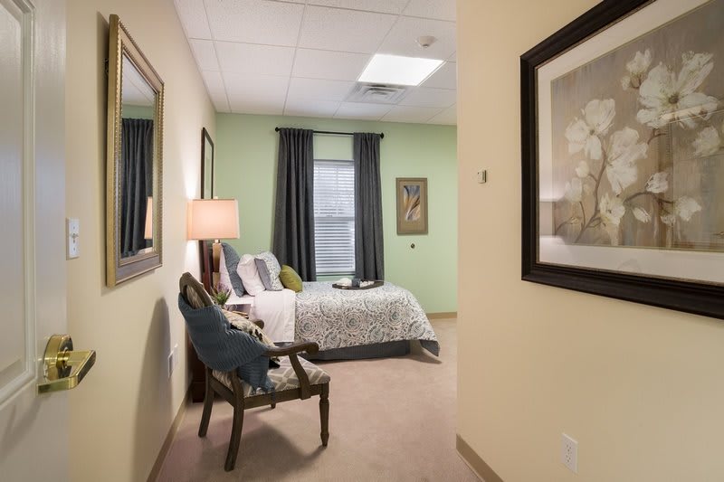 A cozy bedroom with modern decor and soft lighting.