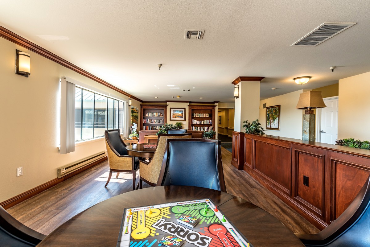 A modern office lobby with comfortable seating and large windows.