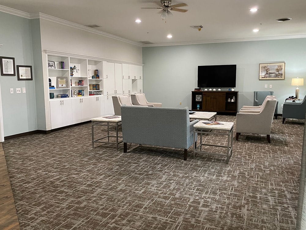 A modern living room with comfortable seating and a television.