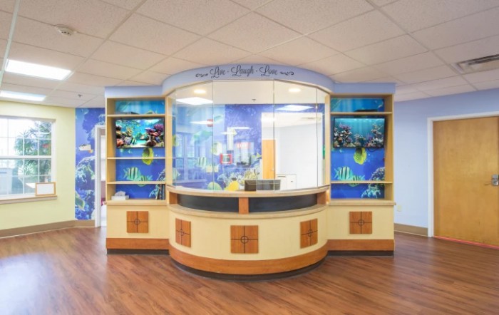 A vibrant and welcoming hospital reception desk designed for a children's area.