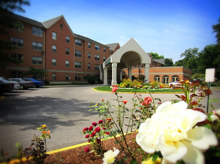 A beautifully landscaped building with an inviting entrance.