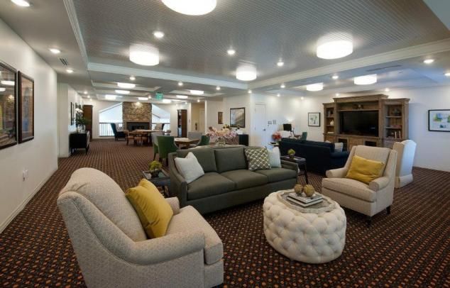 A spacious and well-lit living room with comfortable seating.