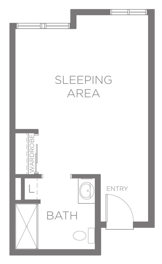 Studio apartment floor plan with designated sleeping area and bathroom.