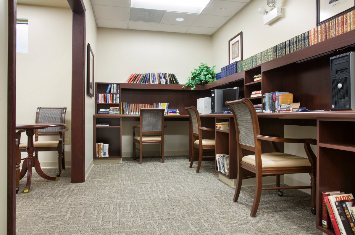 A quiet study room with bookshelves and seating areas.
