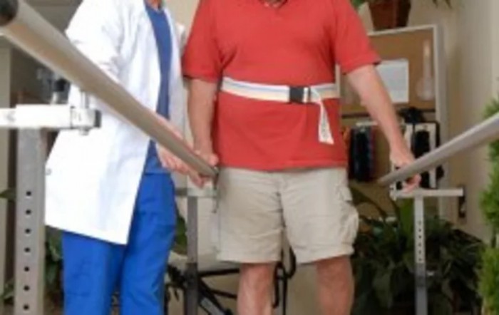 A physical therapist assists a patient during a rehabilitation session.
